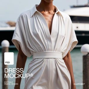 May include: A white dress with a V-neckline and short sleeves. The dress has a belt at the waist and a flowing skirt. The dress is photographed against a backdrop of a yacht and water.
