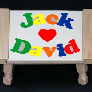 Custom 2 Name Puzzle Stool in Primary Colors with a Heart. An educational toy puzzle for preschool toddler children to learn their 2 names.