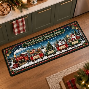 May include: A rectangular floor mat featuring a festive Christmas train illustration with the text "The Smith Family's Christmas Express" and individual train cars labeled with the names Oliver, Sophia, Ethan, and Lucy, set against a snowy scene.