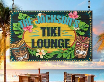 May include: A wooden sign with a tropical theme, featuring the text "The Jackson's Tiki Lounge" in blue and yellow lettering. The sign is decorated with palm leaves, flowers, and tiki masks.