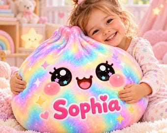 May include: A round, plush pillow featuring a rainbow-colored tie-dye pattern with a printed face showing large black eyes, pink cheeks, and a smiling mouth. The name Sophia is printed in large, bold pink letters across the front.