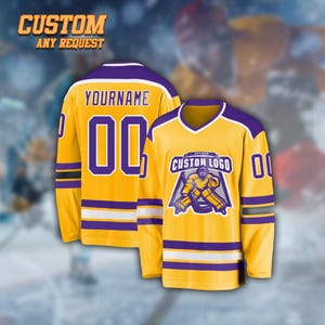 May include: Two yellow hockey jerseys with purple and white detailing. One jersey features the text "YOURNAME" and the number "00" on the back. The other jersey has a custom logo on the front. The text "CUSTOM ANY REQUEST" is at the top.