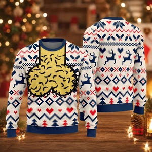 May include: A long-sleeve knit sweater featuring a white base with a repeating pattern of blue reindeer, red hearts, and geometric shapes. The front displays a large, yellow, textured graphic of a scrotum centered against a dark blue neckline.