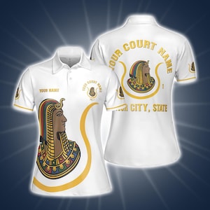 May include: White polo shirt featuring a colorful Egyptian pharaoh design. The shirt has gold accents and the text "YOUR COURT NAME" and "YOUR NAME". The back of the shirt also displays the pharaoh design and text.