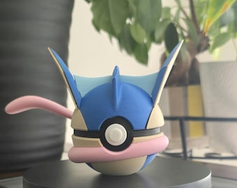 May include: A blue and beige Pokemon figure with a pink tail and white eyes. The figure is a Pokeball with a blue shell and a white center.