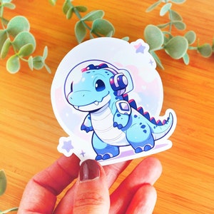 Sticker kawaii Dinosaure de l'espace | Sticker à offrir, sticker bouteille d’eau, sticker smartphone, sticker journal, sticker kindle