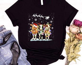 Merry Christmas T Shirt, Christmas Cows T Shirt, Farm Animals Shirt, Cow Lover Gift, Xmas Santa Cow tee, Disneyworld Cow tee,Cow Light Shirt