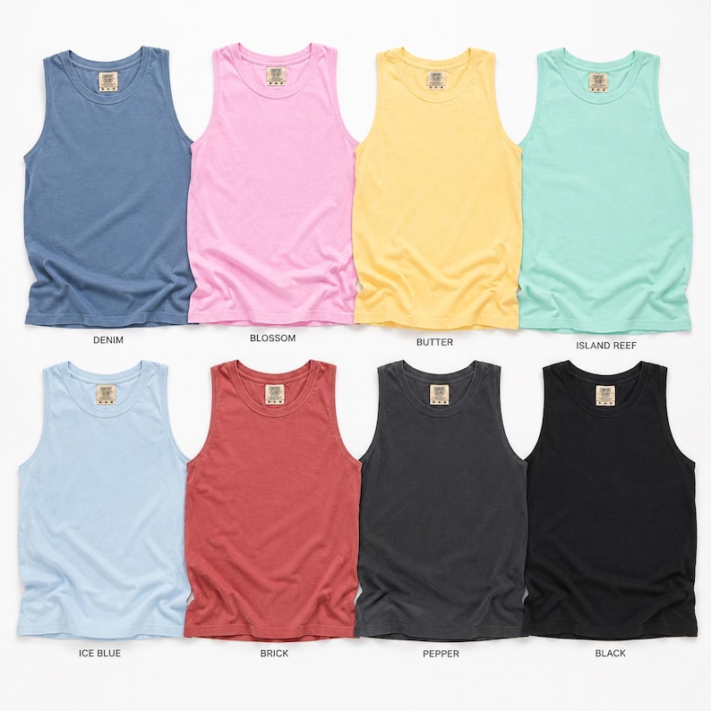 May include: Eight sleeveless tank tops arranged in two rows, featuring colors labeled as denim, blossom, butter, island reef, ice blue, brick, pepper, and black. Each garment has a round neckline and a small rectangular brand label at the inner collar.
