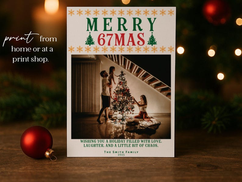 May include: A Christmas card with the text "MERRY 67MAS" in green and red, with a family decorating a Christmas tree. The card also includes the text "Wishing you a holiday filled with love, laughter, and a little bit of chaos."