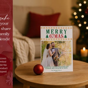 May include: A Christmas card with the text "MERRY 67MAS" and a photo of a couple. A red ornament sits on a wooden table. The card wishes a holiday filled with love, laughter, and a little bit of chaos.