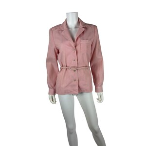 May include: A red and white striped button-down shirt with long sleeves and a collared neckline. The shirt features a chest pocket and a matching belt. The shirt is displayed on a mannequin.