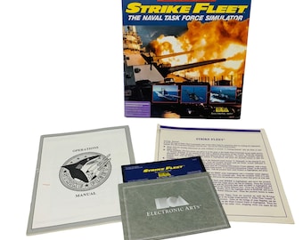 May include: A box for the computer game Strike Fleet: The Naval Task Force Simulator. The box features a picture of a battleship firing its guns. The game is made by Lucasfilm Games and published by Electronic Arts.