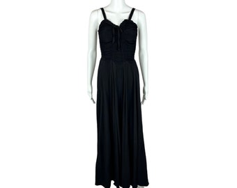 May include: A black maxi dress with a sweetheart neckline and a fitted bodice. The dress has a gathered detail at the bust and a flowing skirt.