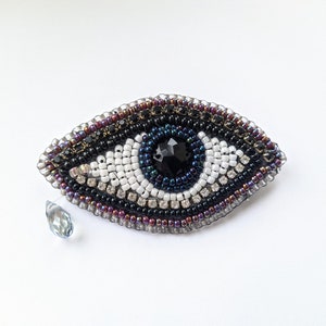 Eye brooch, pin, beaded, tear, iris, pupil, jewelry