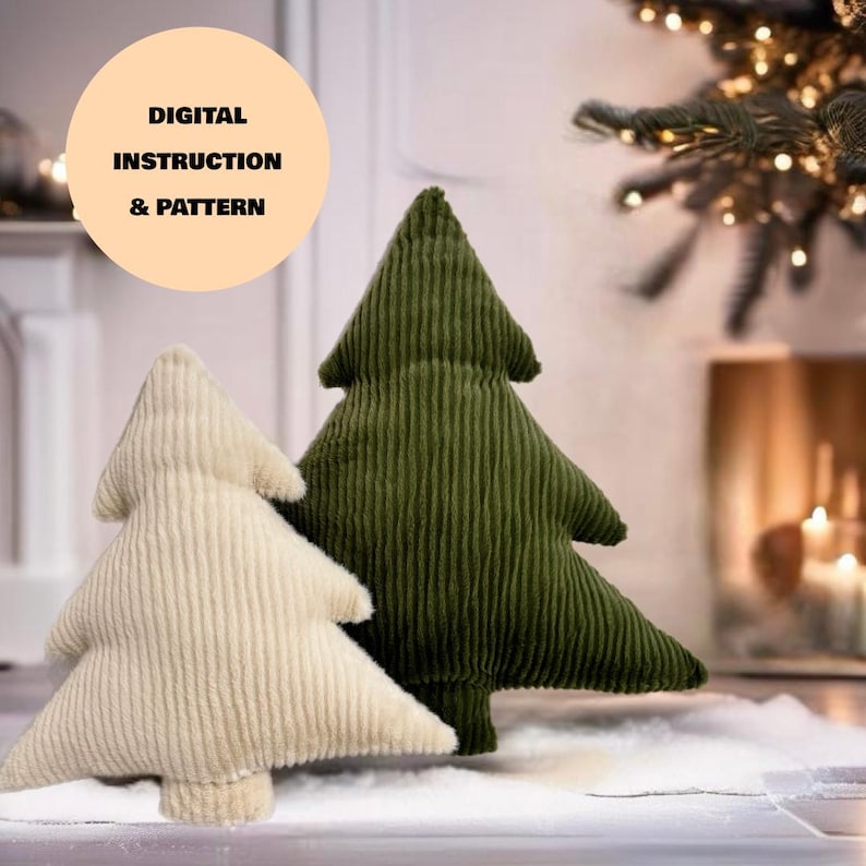 May include: Two plush Christmas tree pillows, one in a cream color and one in a dark green color. The pillows are sitting on a white surface.