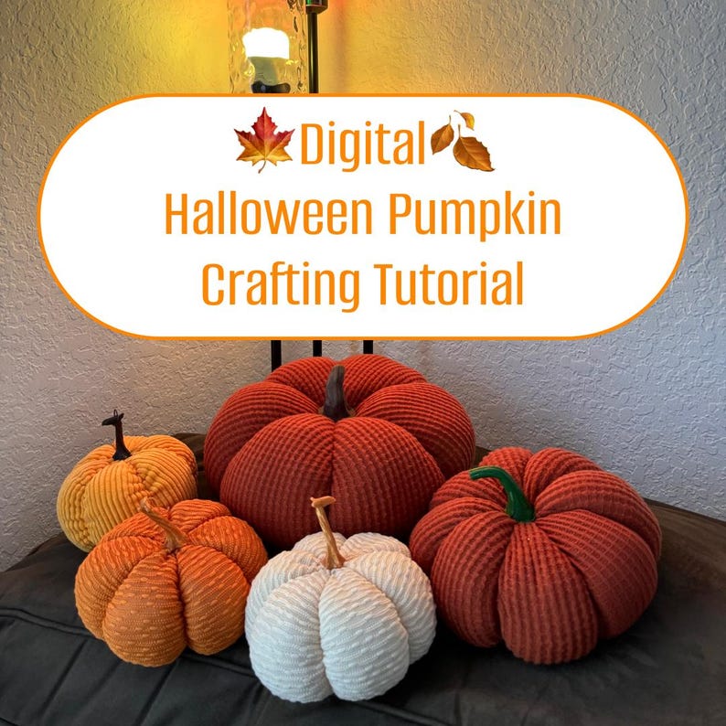 May include: Five fabric pumpkins in various colors, including orange, red, and white. The pumpkins are all sewn with a ribbed texture. The pumpkins are arranged on a dark surface. The text "Digital Halloween Pumpkin Crafting Tutorial" is displayed in a white oval above the pumpkins.