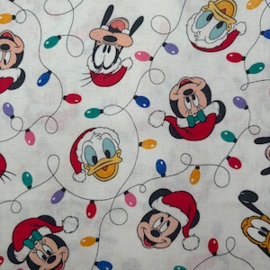 Mickey and Friends Holiday Lights  Cotton Fabric NEW BTY  Christmas Fabric Disney Holiday Fabric