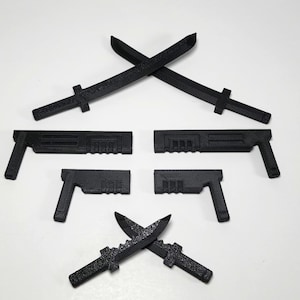 May include: Five black plastic toy weapons, including two swords, two pistols and a dagger. The swords are crossed at the top of the image, the pistols are below them and the dagger is crossed at the bottom of the image.