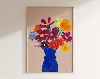 May include: A painting of a bouquet of colorful flowers in a blue vase. The flowers are pink, red, orange, yellow, and purple. The background is a light brown color. The artist's signature, "shaanan", is in the bottom right corner.