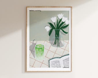 May include: A framed illustration of a green drink with a straw, a vase of white flowers, and an open book on a tiled surface. The text "matcha morning" is at the top of the image and "shrimini" is at the bottom.