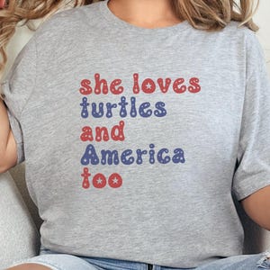 She Loves Turtles and America Too T-Shirt, Patriotic Turtle Tee, USA Lover Gift, Turtle Fan Shirt, Red White and Blue Design