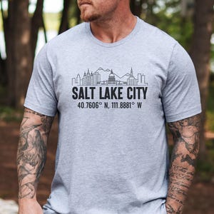 May include: A set of three ceramic mugs with a speckled, matte finish in cream, light grey, and dark grey. Each mug has a simple, minimalist design, suitable for coffee or tea.