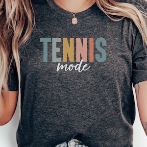 tennis graphic tee, sports lover shirt, retro design, athletic apparel, gift for tennis enthusiasts, trendy casual wear, tennis fan shirt