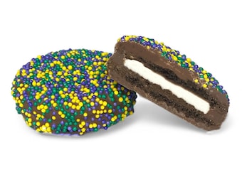 May include: Two chocolate sandwich cookies with a white filling. The cookies are covered in purple, green, and yellow sprinkles.