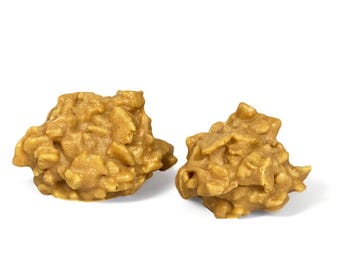 May include: Two golden brown peanut butter and cereal clusters, a popular homemade treat.