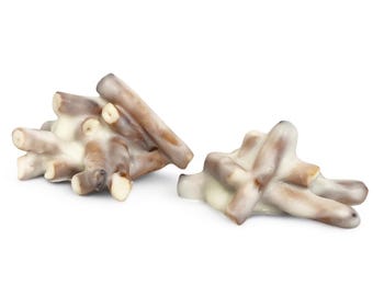 May include: Two clusters of pretzel sticks coated in white chocolate. The pretzels have a light brown color, and the white chocolate coating is smooth and glossy. The background is plain white, highlighting the treats.