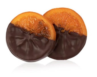 May include: Two orange slices dipped in dark chocolate. The orange segments are visible, with a rich, dark chocolate coating on the bottom half of each slice. The image is set against a white background, highlighting the contrast between the colors.