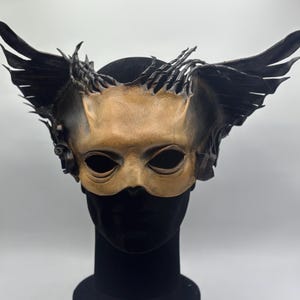 Brown and black  leather mask of Anubis. Masquerade mask leather. Halloween mask.
