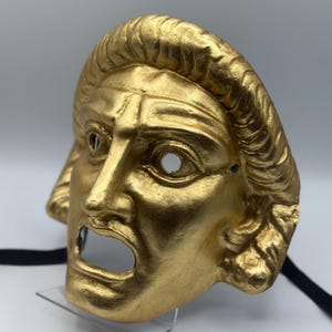 Maschera d'oro di un dio greco - maschera di cartapesta dorata - maschera della mitologia greca e maschera della commedia dell'arte - maschera dorata di Halloween