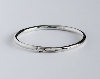 NEW! Thin silver, sewing needle, continuous closed circle, stacking ring.