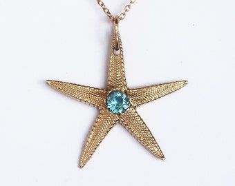 Solid 10k Yellow Gold Starfish Charm with Faceted Blue Topaz Center