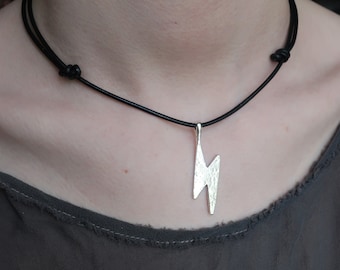 Sterling Silver Hammered Lightning Bolt Pendant hung on adjustable sliding knot black leather cord.