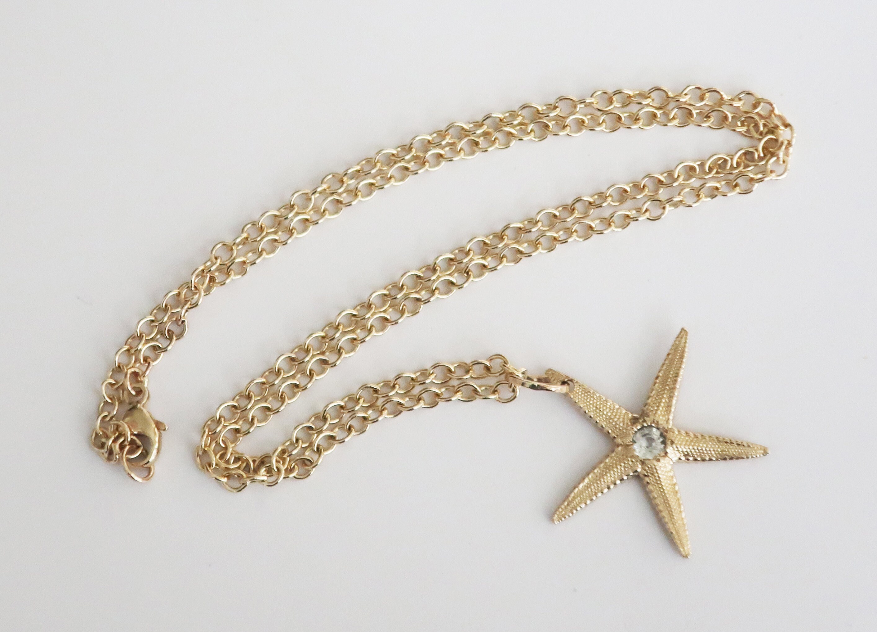 Solid 10k Yellow Gold Starfish Charm with Faceted White Topaz Center