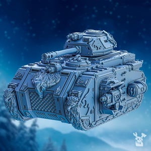 May include: A grey, detailed model of a tank with a large cannon and intricate carvings. The tank has a wolf head design on the front and the words "FREYJA'S BACK" on the side.