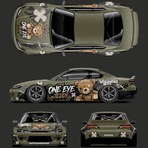 May include: An olive green sports car wrap design featuring a brown teddy bear graphic with a crown and the text ONE EYE TEDDY and WISELABFORGE. The design includes camouflage patterns, white cross symbols, and graffiti-style accents on the hood, sides, and bumpers.