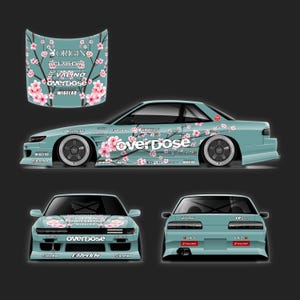 May include: A light blue car shown from the side, front, and rear, featuring a pink cherry blossom branch graphic and the text "overdose" on the hood and side. The design includes various automotive brand logos like Valino, GReddy, and Eneos.