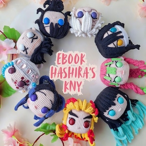 May include: A collection of handmade crochet character dolls arranged in a circle. The dolls feature various hair colors and styles, with detailed facial features and expressions. The text "EBOOK HASHIRA'S KNY" is displayed in the center, with the artist's name at the bottom.