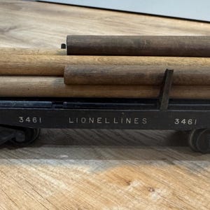 Vintage Lionel 3461 O Gauge Lionel Lines Operating Log Dump Car with Log Load- Very Good Condition and Missing Stakes