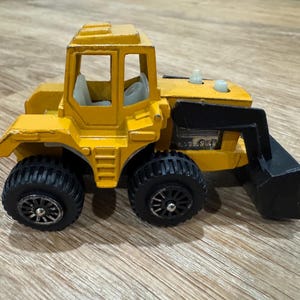 Vintage Tootsietoy frontlastare – 10 cm gjuten anläggningsfordon – funktionell skopa