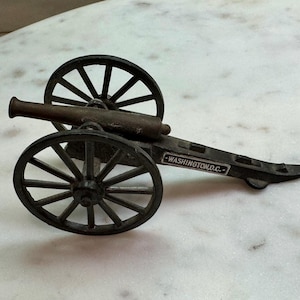 4” Vintage Cast Iron Brass Miniature Cannon marked Japan- Washington, DC Souvenir item circa 1960’s- Canon Tilts- Very Good Condition