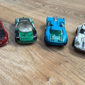 Vintage Hot Wheels Diecast Cars- 1997 Ford GT 90- 1974 P-911 Porsche- 2000 Maelstrom- 2006 Nissan Silvia S-15- Good Condition
