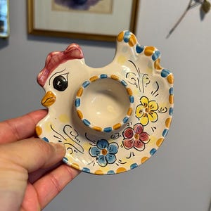 May include: A handmade wooden sign with the text "Welcome" in a playful font. The sign features a distressed white background and a dark brown border, perfect for a front door or entryway. Measures approximately 12 inches wide.