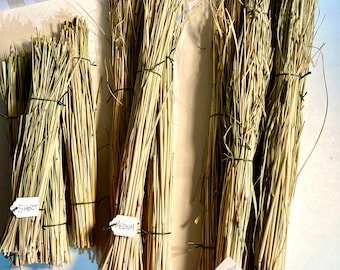 May include: Three bundles of dried natural straw tied with thin green wire. Each bundle features a small white paper tag with handwritten text: the left bundle is labeled SHORT, the center is labeled MEDIUM, and the right is labeled LONG.