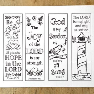 May include: Four black and white bookmarks with inspirational quotes and decorative elements. The bookmarks feature phrases like "Be strong," "The Joy of the Lord," and "God is my Savior." Each bookmark includes a Bible verse reference.