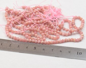 Rhodochrosite 4 mm round bead . 15 inches . 38 cm strand