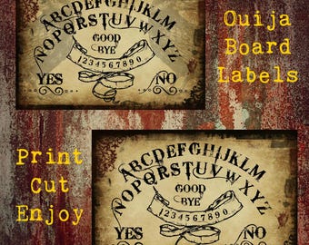 May include: Two printable Ouija board labels with a vintage, distressed look. The labels feature a classic Ouija board design with letters, numbers, and the words "YES", "NO", "GOOD BYE".